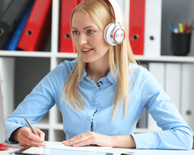Danish women working on a laptop, symbolizing reliable and affordable Danish transcription services with compliance.
