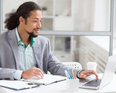 A man works with certified transcription services ensuring industry-specific accuracy, compliance,legal,medical,and business.