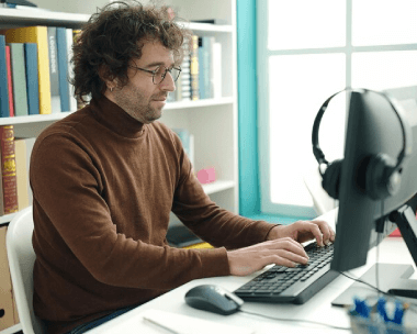 A professional transcriber works on Danish multilingual transcription services, ensuring precise language translation.