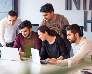 A team of Portuguese to English transcribers working on a transcription project.