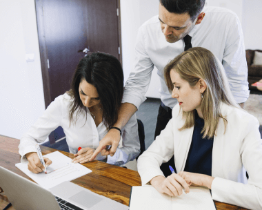 Various professionals using transcribed documents, showcasing the diverse applications of certified transcription services.