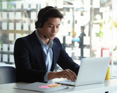 A Korean verbatim transcriptionist working on a laptop, word-for-word Korean transcription with high accuracy.
